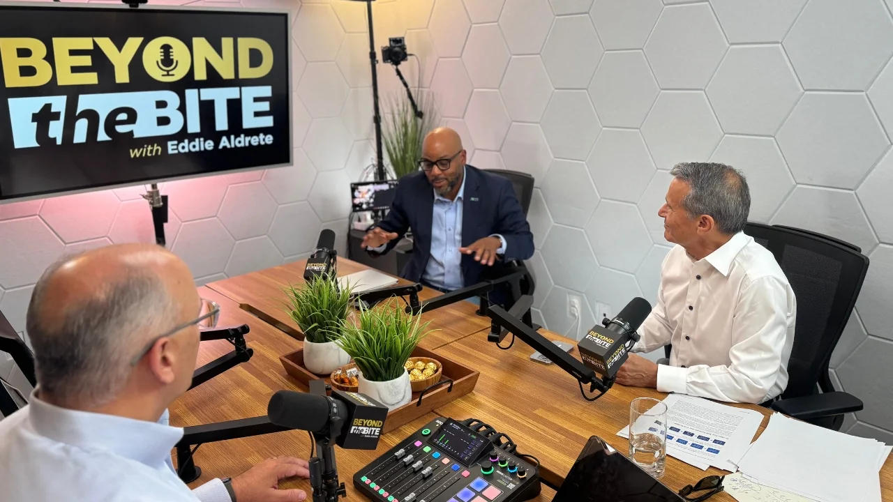 Three guests recording the Beyond the Bite podcast in the four-person studio at SA Cowork in San Antonio, with multicam setup and on-screen show branding